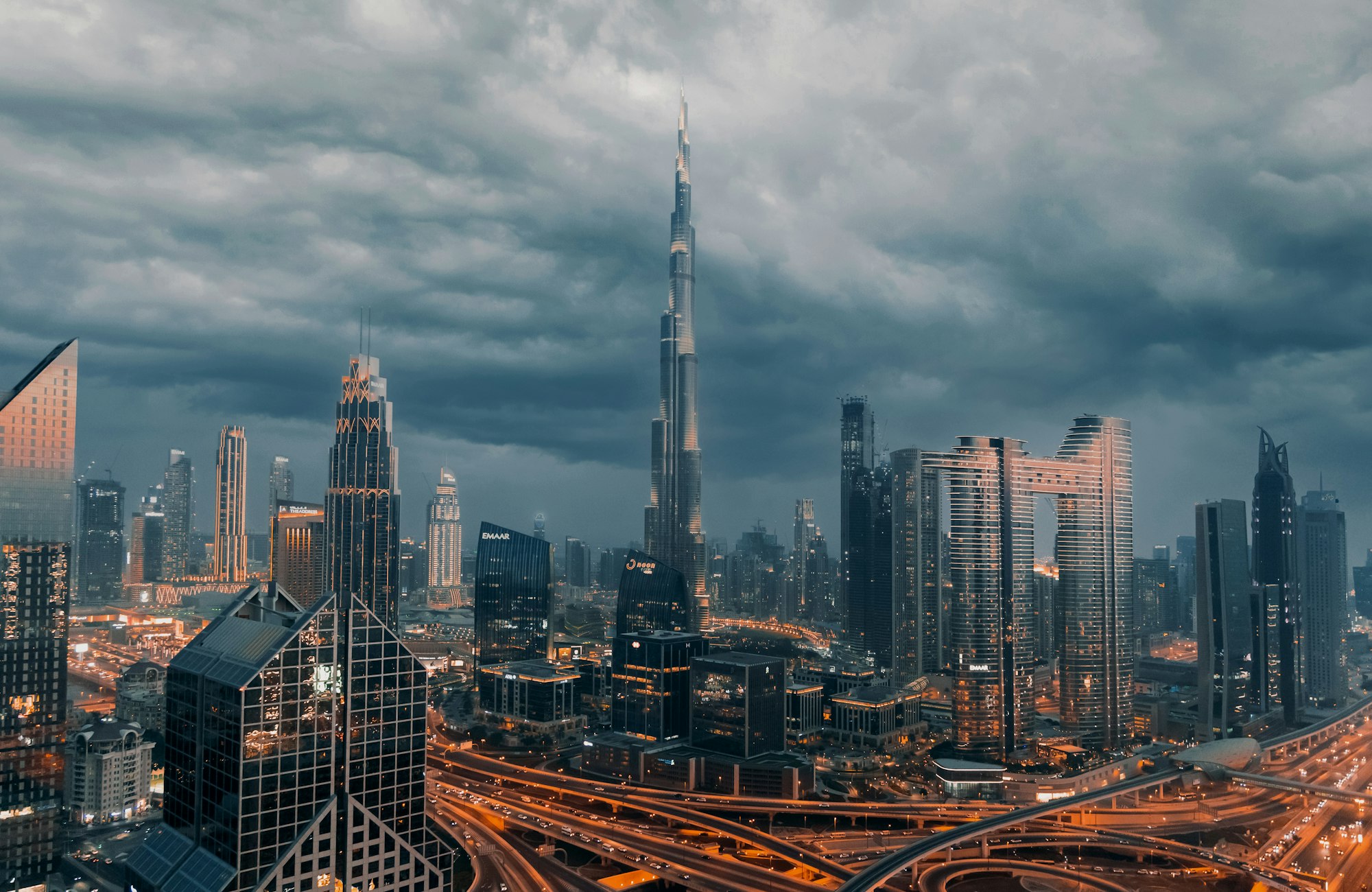 Downtown Dubai under a heavy evening sky